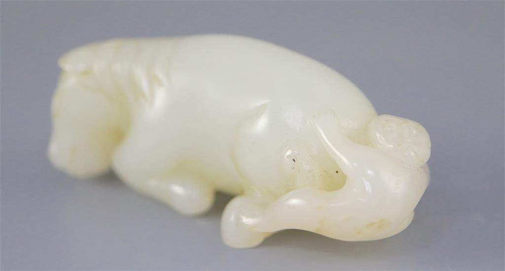 A Chinese white jade group of a recumbent horse and boy, 6cm long